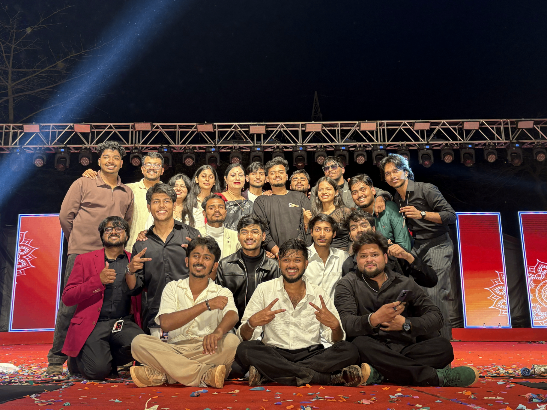 Silicon Photography Club team celebrating on stage after an event